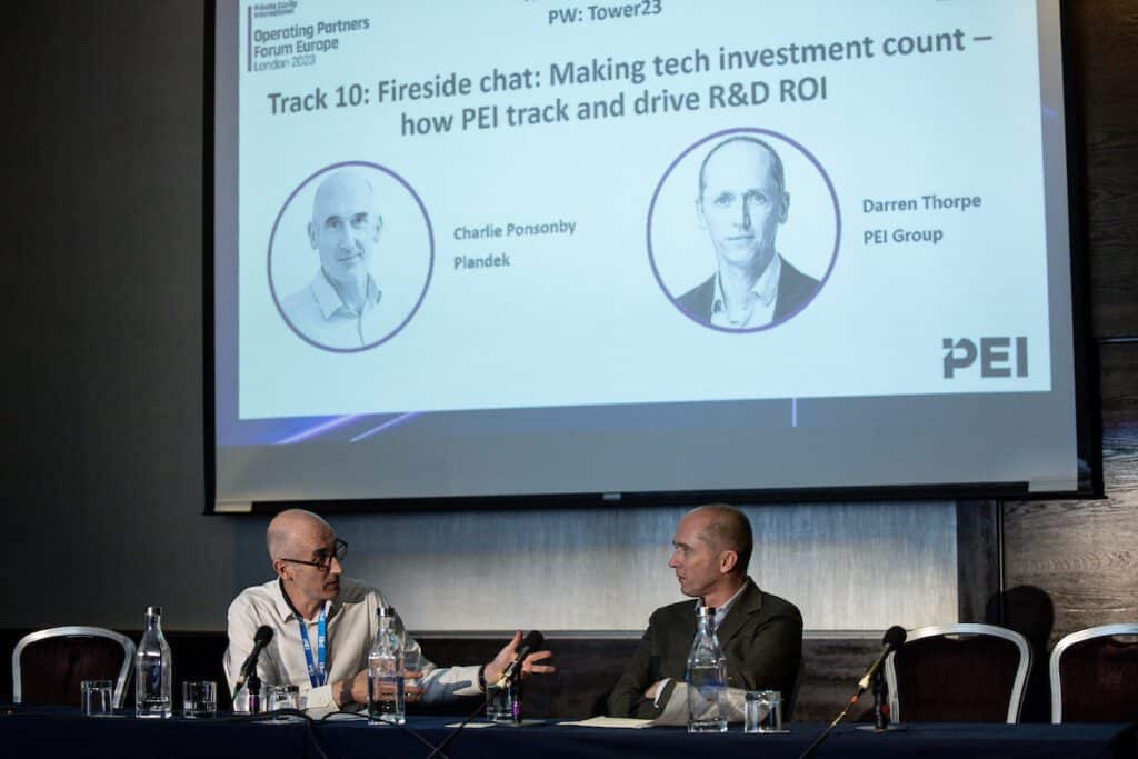 Charlie Ponsonby talking with Darren Thorpe at a PEI conference in London.